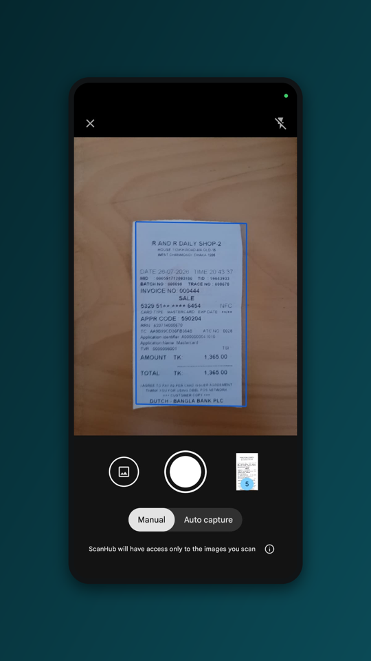 ScanHub camera view detecting the edges of a document on a table, with auto-capture